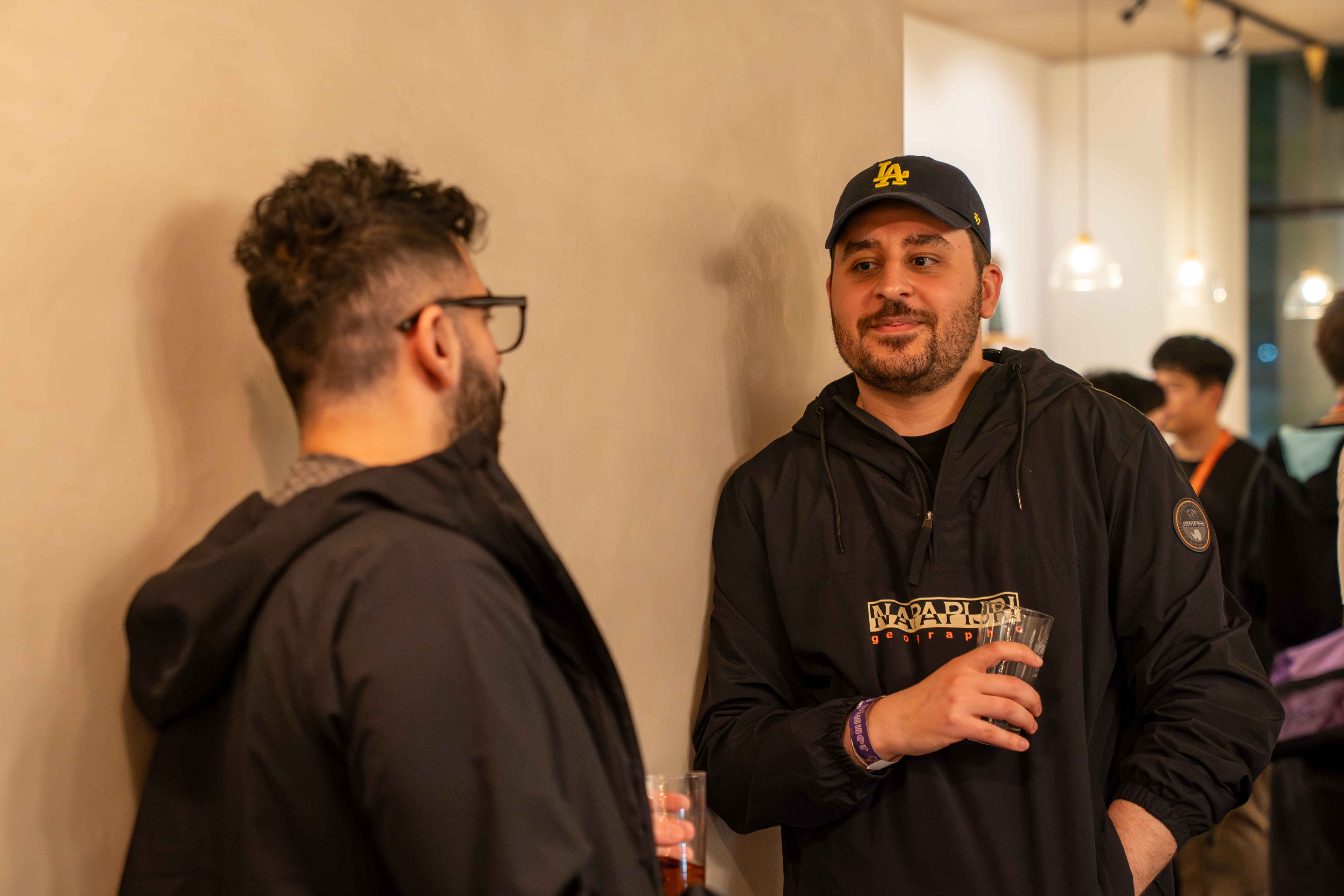 Issam at a casual gathering, wearing a navy LA Dodgers cap